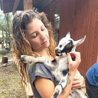Shahad holding a baby goat